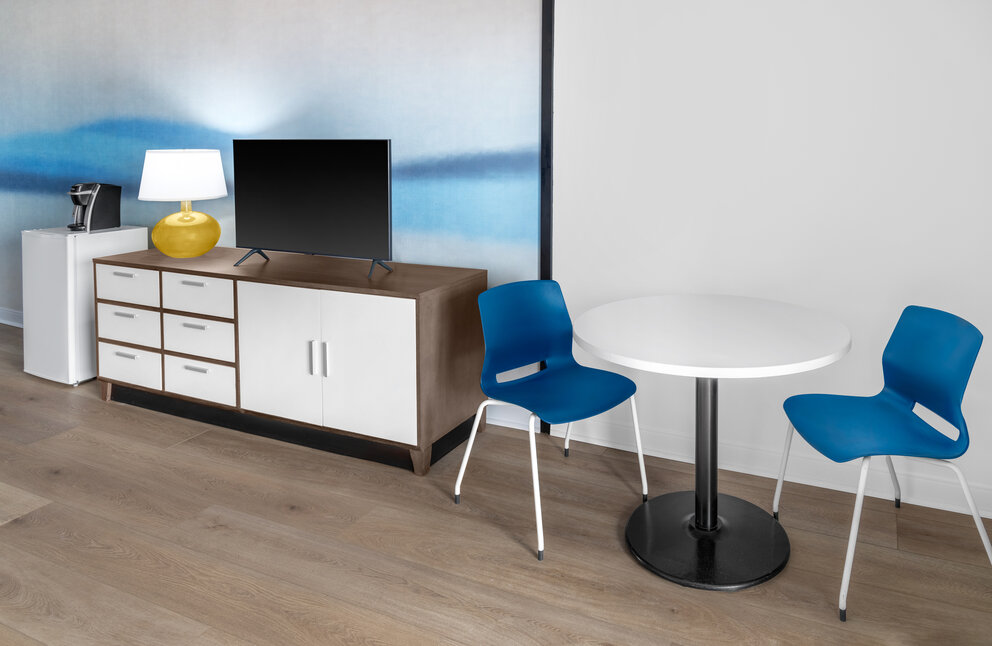 a room with a table and chairs