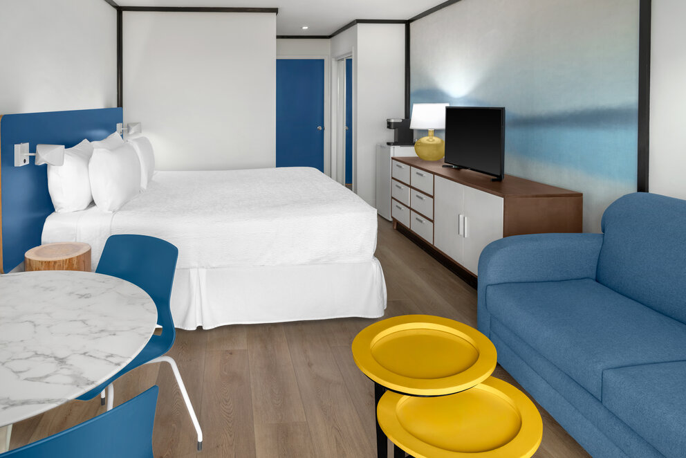 a room with a bed and a tv